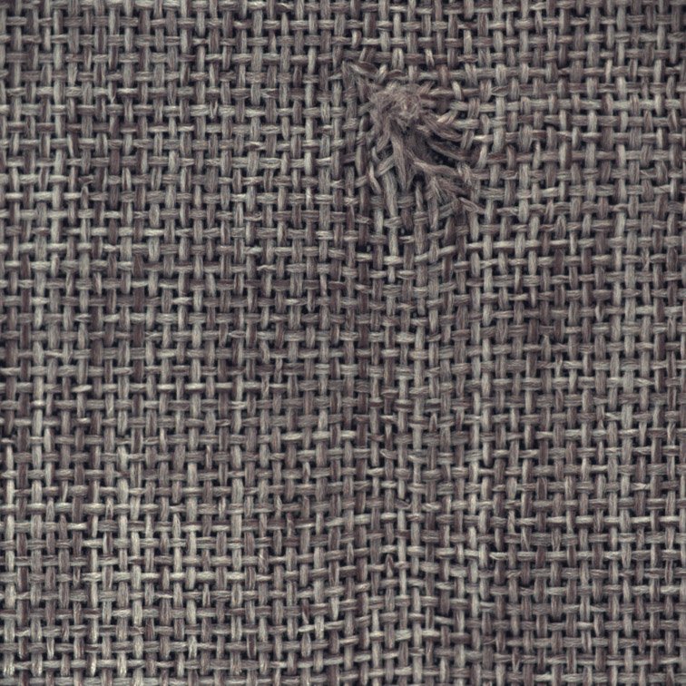 Real carpet defect sample showing a cut defect for AI inspection train Real carpet defect sample showing a cut defect for AI inspection training.