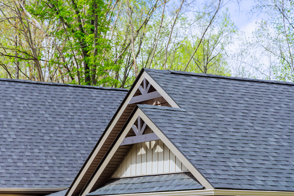 Asphalt roof shingle display on house