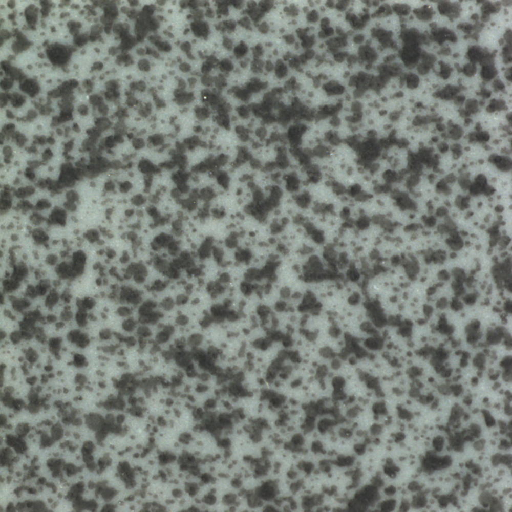 Close-up of a speckled gray and black textured surface, like granite.