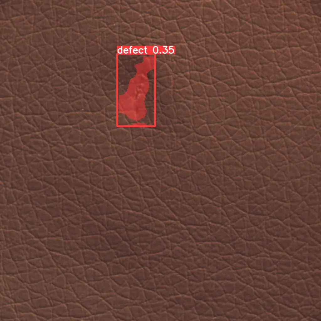 Red bounding box highlights a leather defect labeled 'defect 0.35' on Red bounding box highlights a leather defect labeled 'defect 0.35' on brown textured leather.