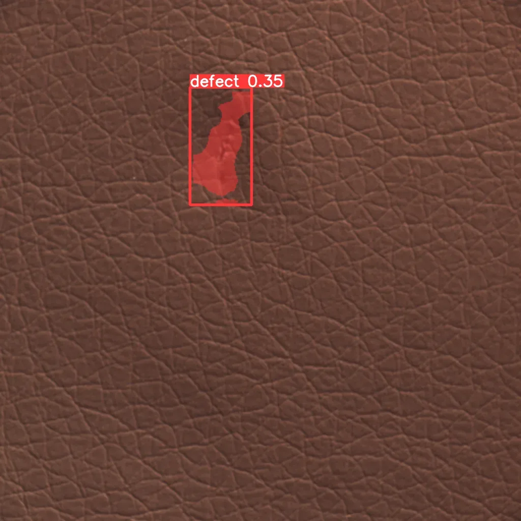 Leather defect detection result with ai inspection overlay AI defect detection result highlighting a surface flaw on brown leather with a red defect mask and confidence label.